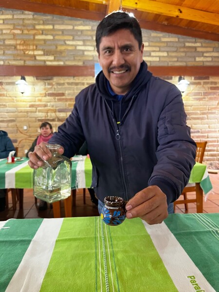 serving mezcal for breakfast in the sierra norte with a smile. 