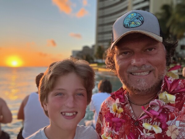 sunset father son waikiki beach oahu hawaii