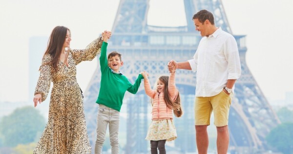 Family photo at the Eiffel Tower, Paris, France