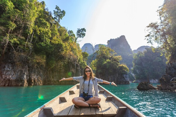 women travel boat in asia tropics