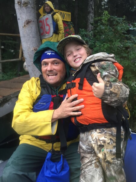 father son preparing to raft in alaska